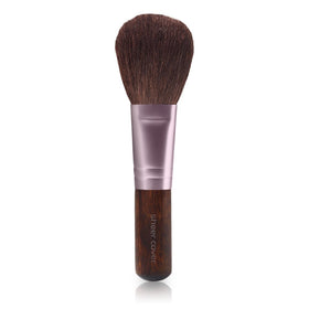 Sheer Cover application with brush on face, demonstrates buildable coverage benefit