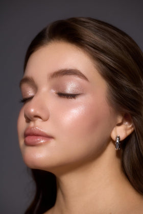 SHEGLAM Champagne Gleam applied on eyelid in lifestyle shot producing brightening effect
