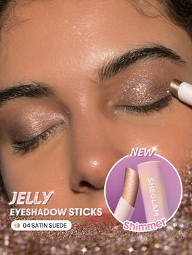 SHEGLAM swatch of Satin Suede on forearm showing buildable shimmer payoff