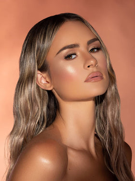 SHEGLAM dropper applicator releasing shimmer for precise targeted glow