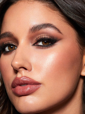 SHEGLAM application at mirror in lifestyle setting, easy on-the-go touch-up benefit