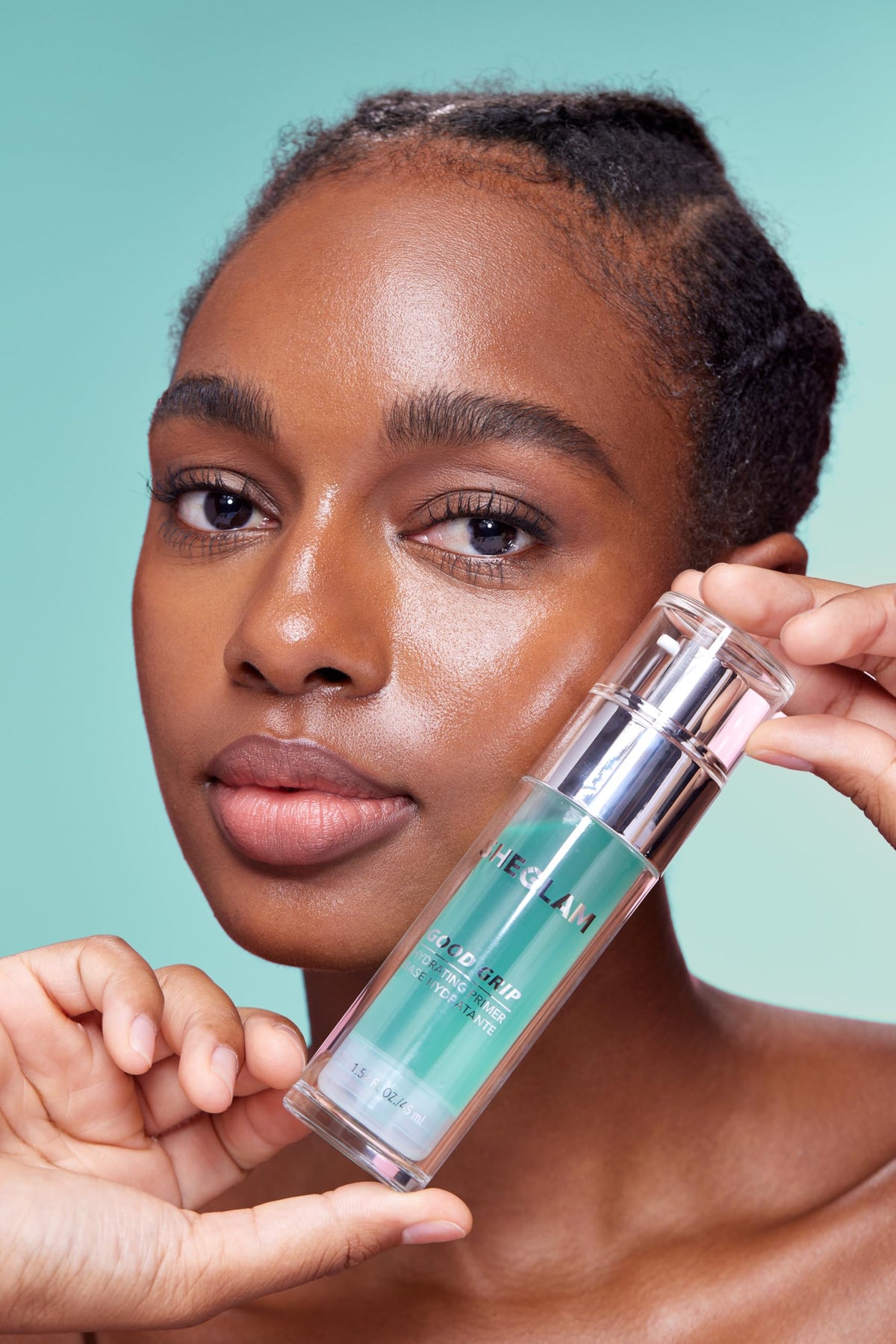 SHEGLAM bottle next to a coin showing compact size and travel-friendly benefit