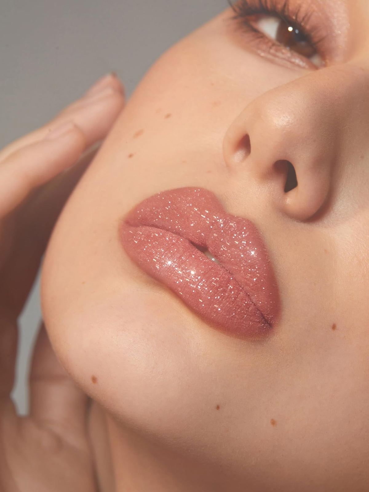SHEGLAM on lips at night showing long-lasting shiny glitter effect
