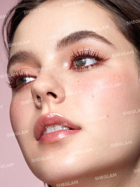 SHEGLAM mascara wand close-up showing patented brush for lift