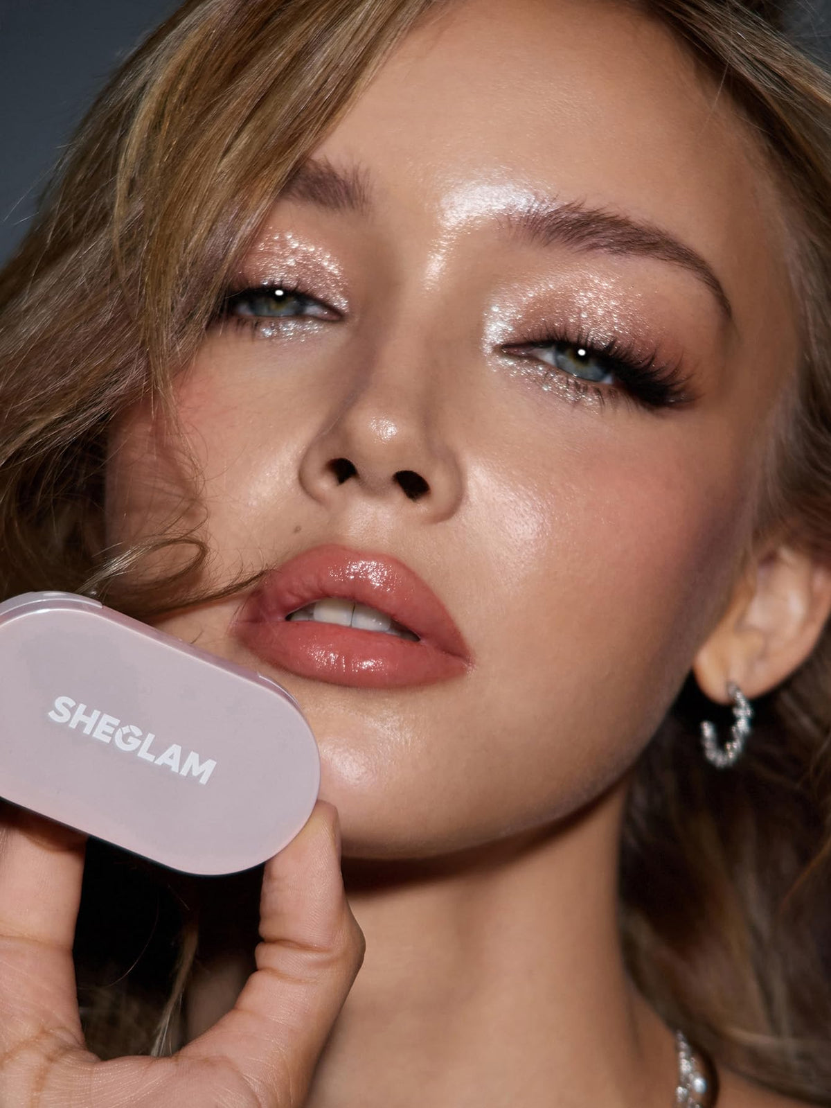 SHEGLAM vanity scene showing product in a travel-ready makeup setup