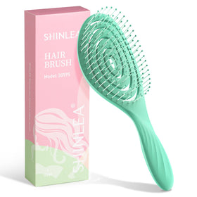 SHINLEA front view of green detangle brush showing ergonomic shape and quick grooming
