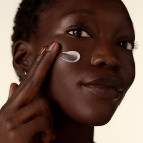 Shiseido Benefiance being applied on hand demonstrating fast absorption and non-greasy feel