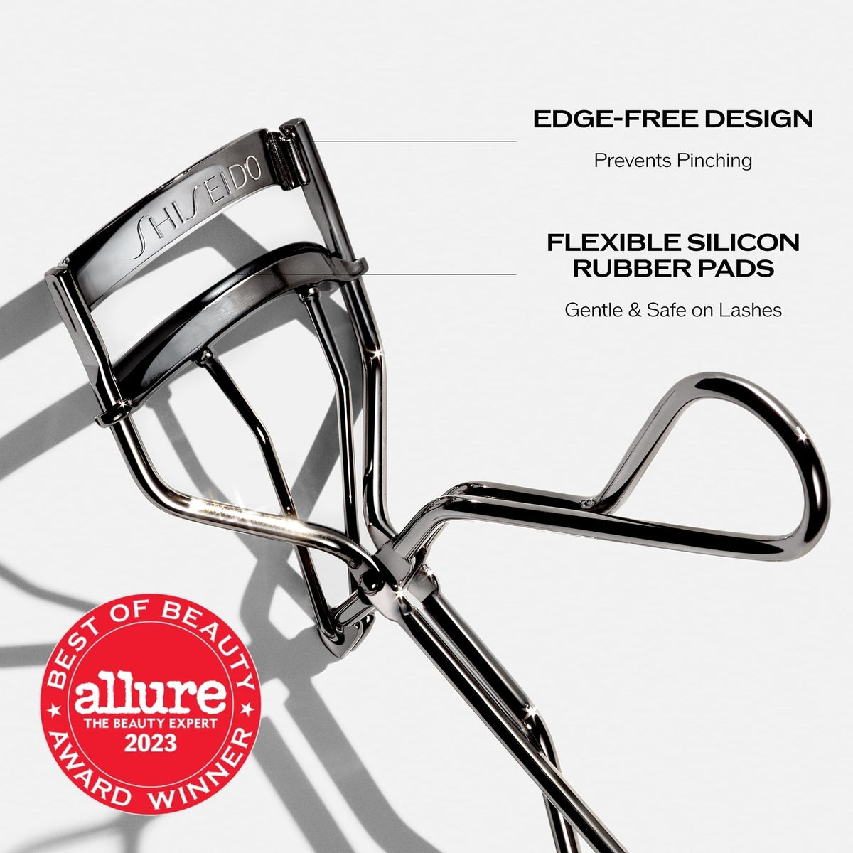 Shiseido curler side profile highlighting broad curve for full lash capture
