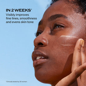 Shiseido 50 mL tube in hand demonstrating portable sun protection