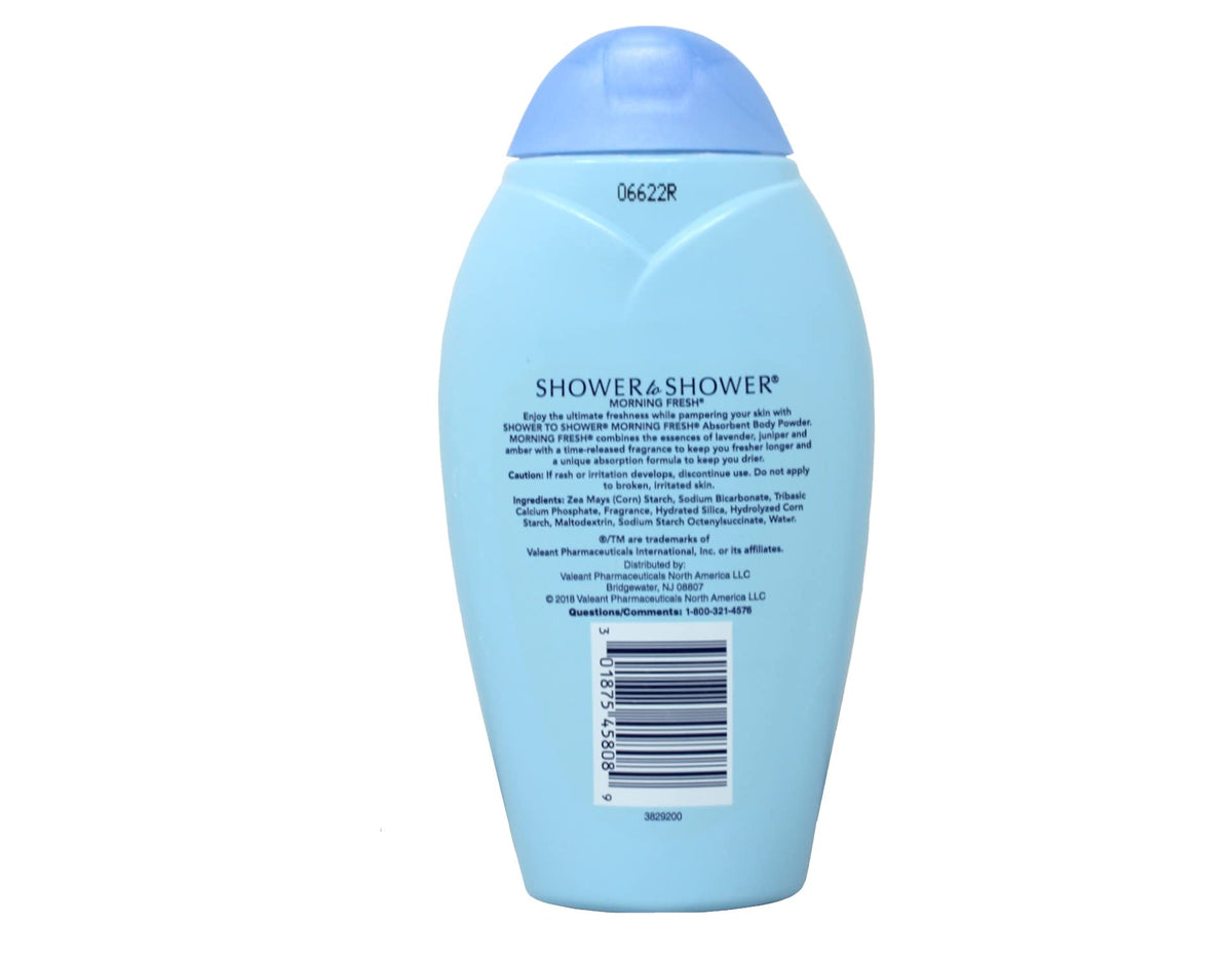 Shower To Shower 8 oz jar next to hand to show portable size convenience