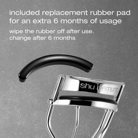 shu uemura curler beside ruler showing compact size and portability