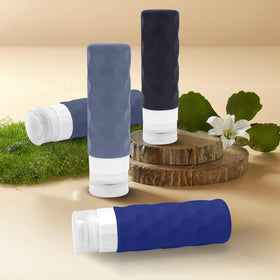 Silevoler bottles beside passport and keys illustrating compact travel-friendly size