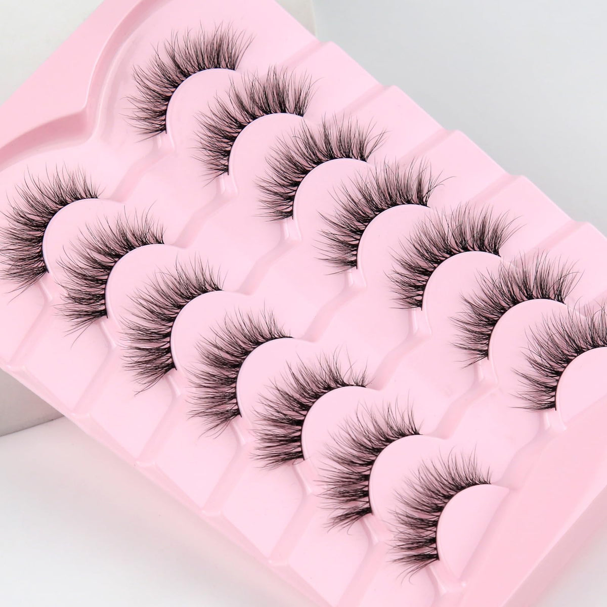 Siligli lashes next to ruler showing 8–14mm graduated lengths