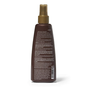 Silk Elements spray in hand demonstrating even mist for smoother styling
