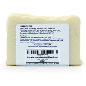 Close-up of Silver Miracles soap lather texture on hand, creamy suds for smooth shave