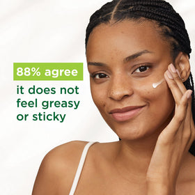 Simple dispensing moisturizer on fingertip to show recommended hazelnut amount