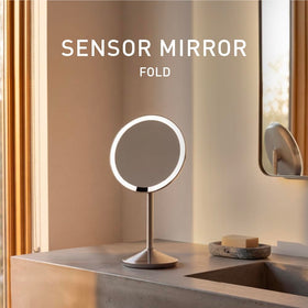 simplehuman mirror open on vanity at angle showing bright Tru-Lux lighting for makeup