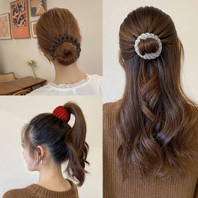 Sizobi clip expanded to show 3.5-inch ring for accommodating thick hair comfortably