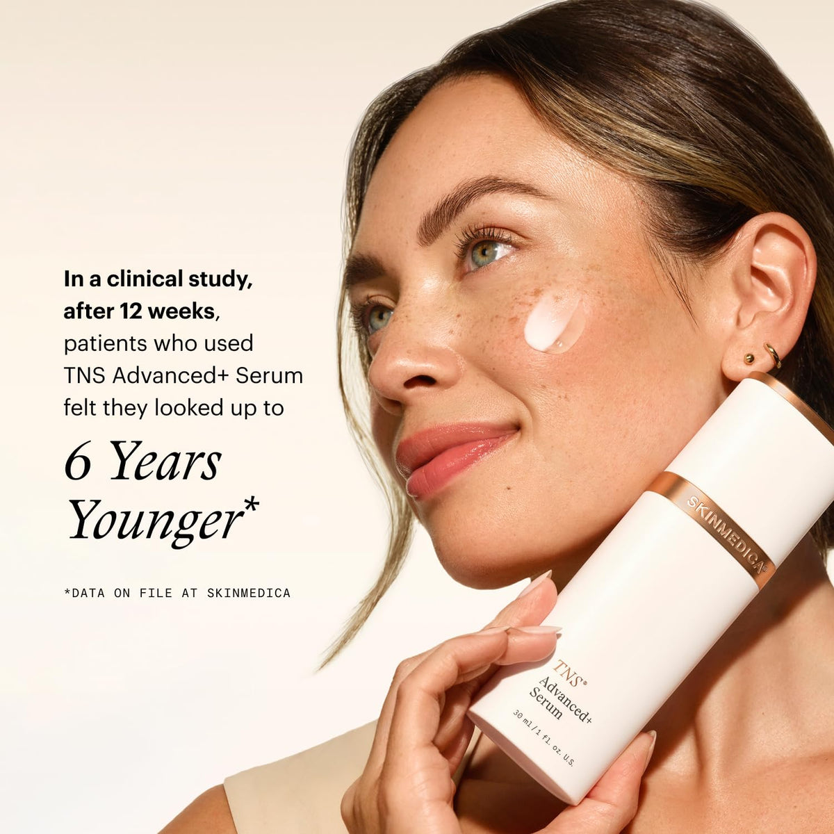 SkinMedica bottle held in hand to show true product size and scale