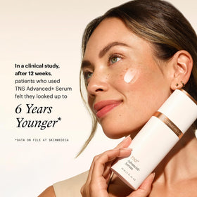 SkinMedica bottle held in hand to show true product size and scale