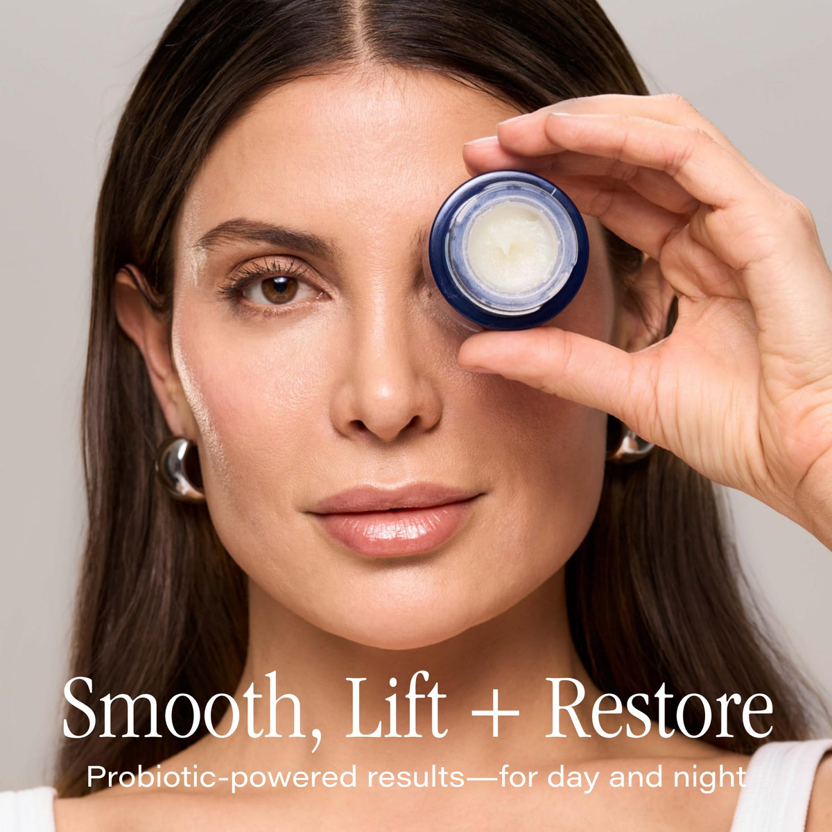 SKINN balm close-up texture melting on fingertip, shows deep hydration benefit
