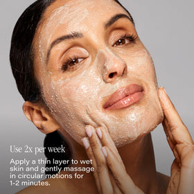 SKINN applying scrub to cheek showing even coverage and smooth finish