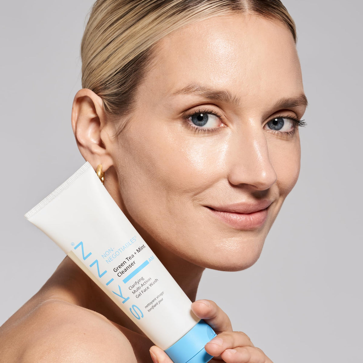 SKINN cleanser on bathroom counter as part of morning routine prep