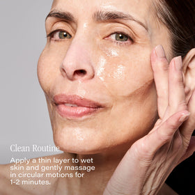 SKINN label close-up showing key actives AHA, green tea and mint benefits