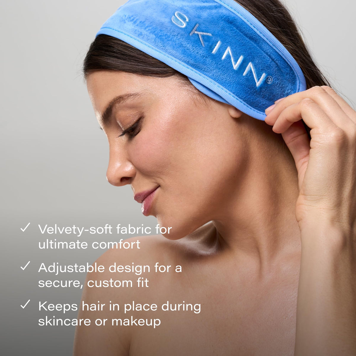 SKINN cream scrub in hand demonstrating easy scoop and control