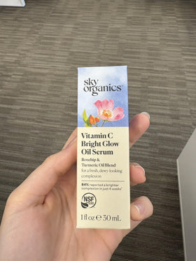 Sky Organics being applied to a model's cheek demonstrating hydration and glow benefits