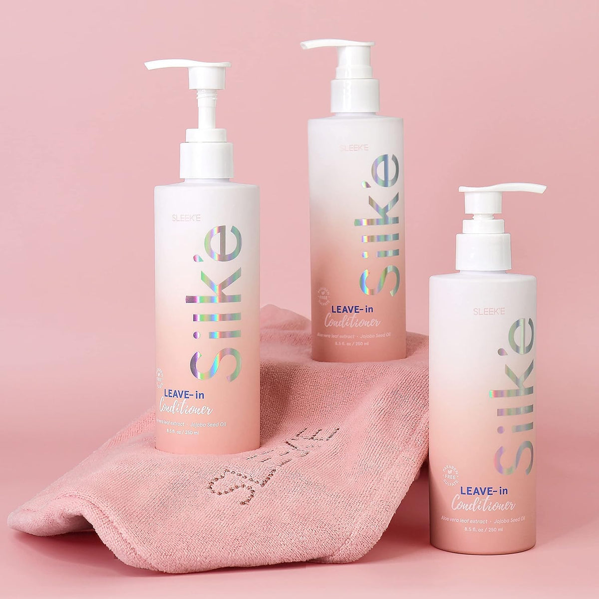 Sleek'e bottle in hand showing 250ml size for travel and routine