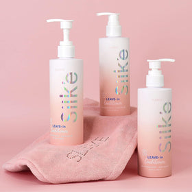 Sleek'e bottle in hand showing 250ml size for travel and routine