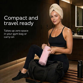 Slinkko towel held in hand showing lightweight, travel-friendly benefit