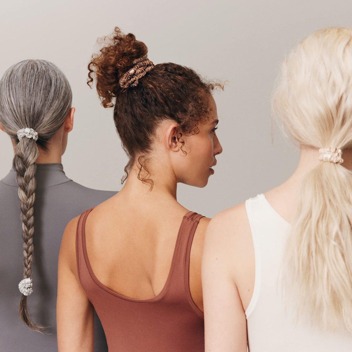SLIP scrunchie in a low bun outdoors, protective styling while active benefit