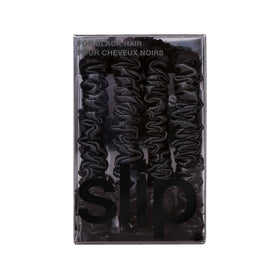 Slip scrunchie next to a ruler showing skinny profile and discreet size benefit