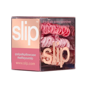 Hand holds SLIP scrunchie to show size and travel-friendly scale