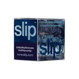 SLIP silk scrunchie held in hand to show scale and gentle tension benefit