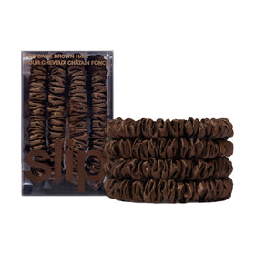 SLIP front packaging showing four skinny silk scrunchies, elegant storage benefit