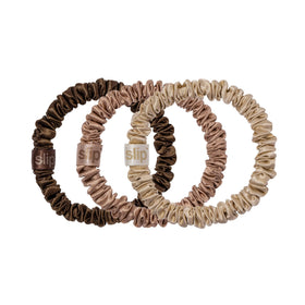 SLIP front view of three slipsilk skinny scrunchies showing colors and sleek finish benefit protects hair