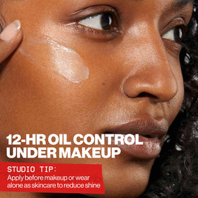 Smashbox primer applied to hand demonstrating smooth base and reduced shine