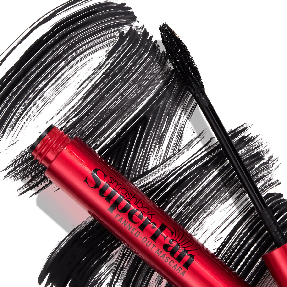 Smashbox mascara held in hand to show compact 0.34 fl oz size and portability