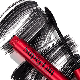 Smashbox mascara held in hand to show compact 0.34 fl oz size and portability