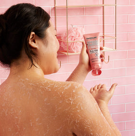 Soap & Glory scrub being applied to hand demonstrating smooth application and immediate softening benefit