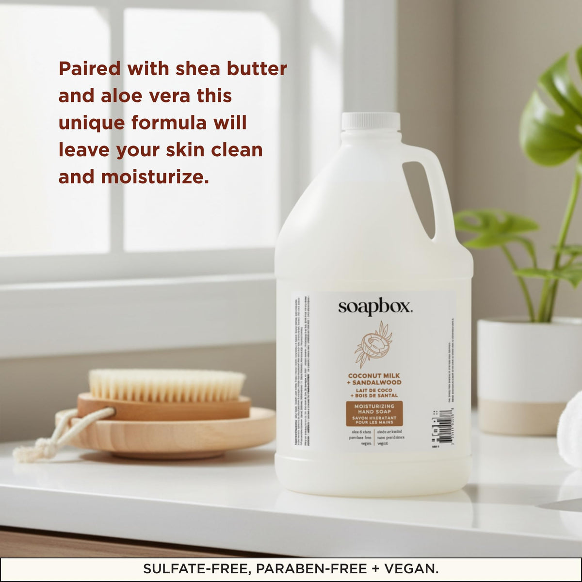 Soapbox gallon beside a bathroom sink for scale, highlights large 128oz capacity
