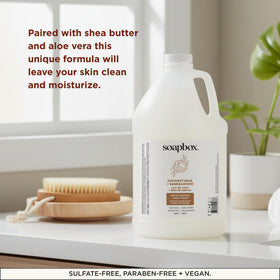 Soapbox gallon beside a bathroom sink for scale, highlights large 128oz capacity