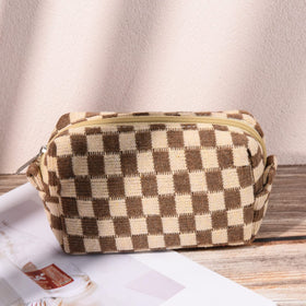 SOIDRAM pouch next to hand showing size and portability benefit