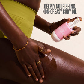 Sol de Janeiro oil being applied to forearm demonstrating smoother skin benefit