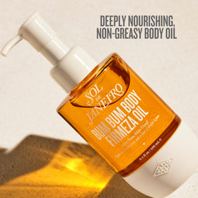 Sol de Janeiro oil application on thigh demonstrating firming massage benefit