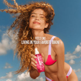 Sol de Janeiro mist applied to hair illustrating light scenting and freshness benefit