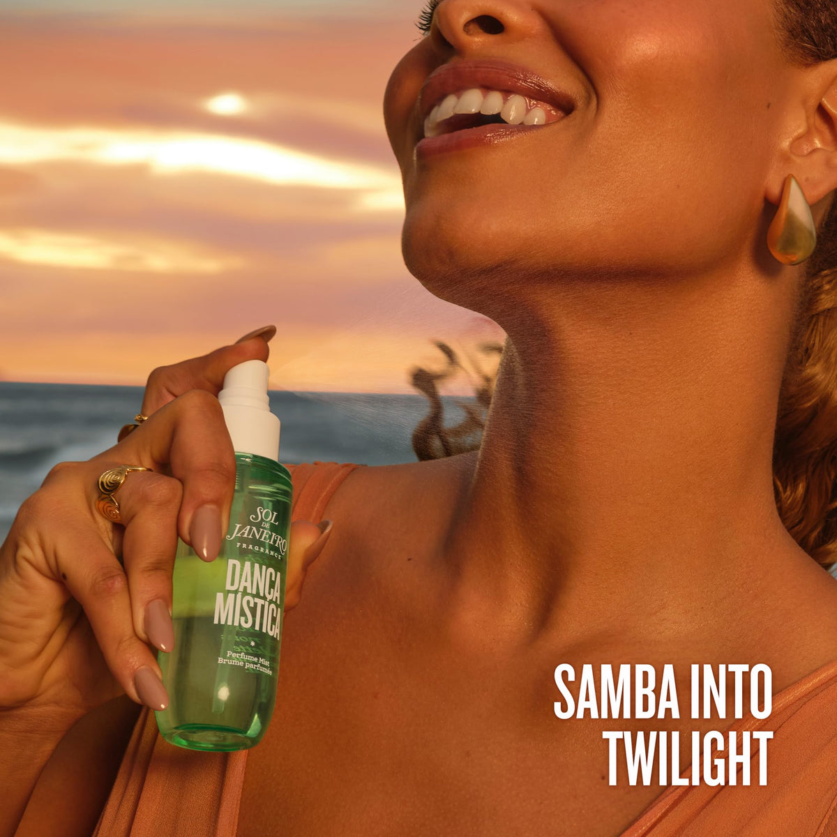 Sol de Janeiro mist applied to hair mid-lengths to add fragrance and shine